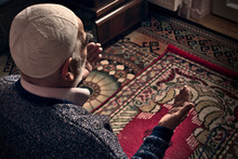 Very Old Turkish Muslim Man At His 80's Praying To Allah At Home On His Rug