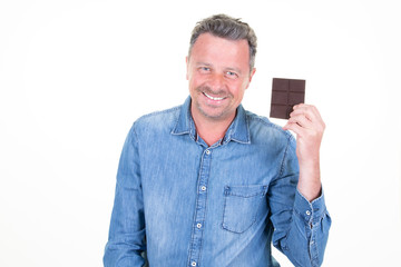 handsome man presenting bar of chocolate in his hand  isolated over white background