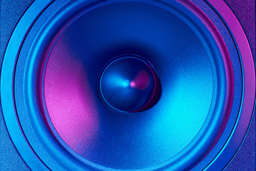 sound audio speaker with neon lights. dynamic monitor close up. creative backgroound