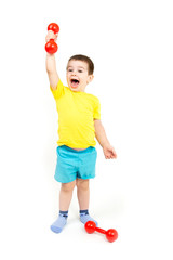 Wall Mural - the happy boy is engaged in fitness, sports with red dumbbells