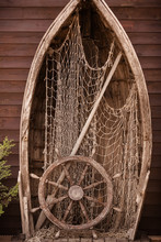 Wooden Boat Wall Composition With Fishing Net Andvitage Ship's Wheel Helm. Art Desing.