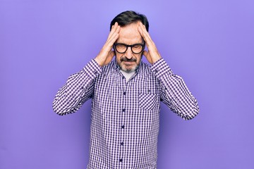 Middle age handsome man wearing casual shirt and glasses over isolated white background with hand on head, headache because stress. Suffering migraine.