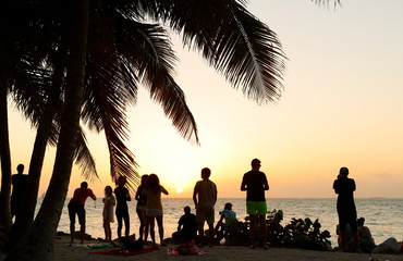 Wall Mural - A Group of Tourists Watching Sunset at Fort Zachary Taylor Historic State Park, better known as Fort Taylor, Florida USA