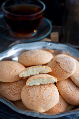 Wall Mural - Homemade sugar cookies with craquelure crust in a metal vase, selective focus