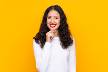 Sticker - Mixed race woman over isolated yellow background laughing