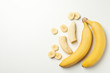 © Atlas - Bananas on white background, top view. Fresh fruit