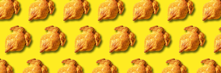 Wall Mural - colorful pattern of roasted chicken or turkey on yellow background. top view. creative design for pa