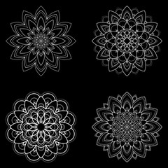 Wall Mural -  Set of four ethnic round Mandala ornaments isolated on black background. Henna tattoo design. Vector illustration