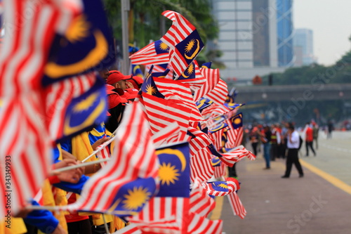 Fotografía Group Of People Holding Malaysian Flag During Parade