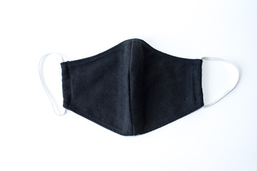 A black cloth mask in a white scene