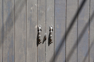 Grey wood door - or gray wooden plank surface texture background - vintage style