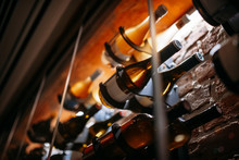 Wine Cellar Full Of Wine Bottles. Bottles With Wine On Shelf In The Wine Bar