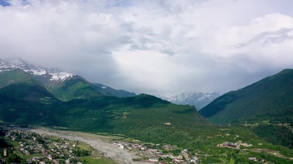 Wall Mural - flight over Svan Towers in Mestia, Svaneti region, Georgia. It is a highland townlet in the northwest of Georgia, at an elevation of 1500 meters in the Caucasus Mountains.