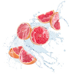 Wall Mural - grapefruit slices in water splash isolated on a white background