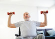 © Lumos sp - wheelchair senior man exercise physical therapy exercising retirement home elderly man dumbbell recovery