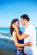 © blicsejo - Young happy couple on seashore