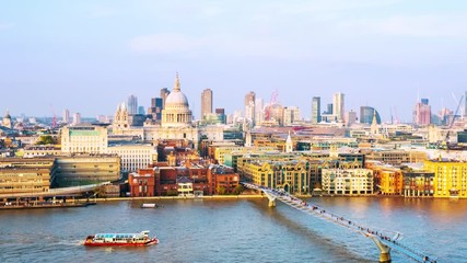 Sticker - London, UK. Aerial view of skyline in London, England, UK with famous modern skyscrapers and other buildings during the evening. Time-lapse with moving boats at Thames river