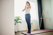 © alfa27 - calm caucasian woman stand meditating at home, have rest after yoga exercises, in light room