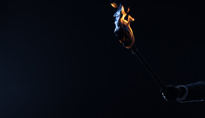 Wall Mural - fire torch in the dark