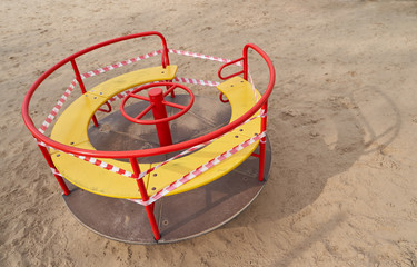 A closed playground for children with tape during the COVID-19 pandemic, Coronavirus.