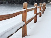 Close-up Of Frozen Railing By Lake During Winter