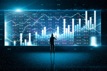 Hacker drawing glowing stock chart and investment data