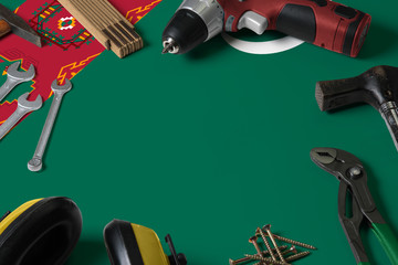Turkmenistan flag on repair tool concept wooden table background. Mechanical service theme with national objects.