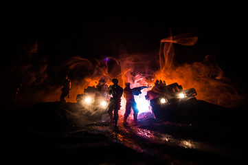 War Concept. Battle scene on war fog sky background, Fighting silhouettes Below Cloudy Skyline at night.