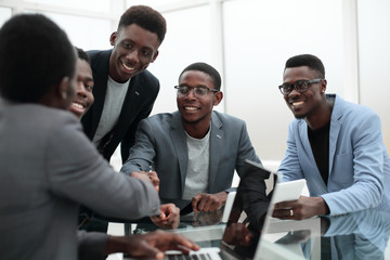 Wall Mural - group of employees looking at the screen of a digital tablet.