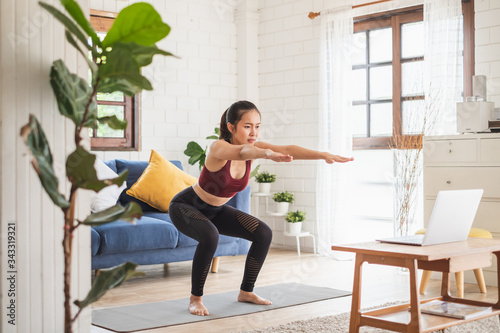 Fotografía Young Asian healthy woman workout at home, exercise, fit, doing yoga, home fitne