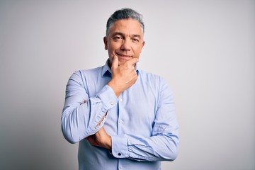 Poster - Middle age handsome grey-haired business man wearing elegant shirt over white background looking confident at the camera smiling with crossed arms and hand raised on chin. Thinking positive.