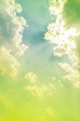 sunshine and sun rays in bright green sky with blue light