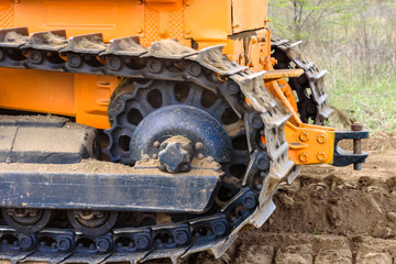 Industrial building construction site bulldozer leveling and moving soil during highway building