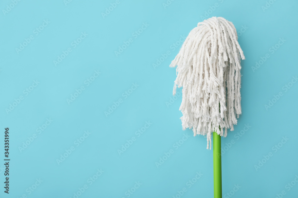 Floor mop on color background