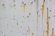 © Worklike - White concrete walls with rust stains as the background