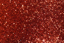 Red Sparkling Lights Festive Background With Texture. Abstract Christmas Twinkled Bright Bokeh Defocused And Falling Stars. Winter Card Or Invitation	
