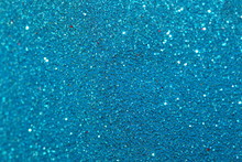 Blue Sparkling Lights Festive Background With Texture. Abstract Christmas Twinkled Bright Bokeh Defocused And Falling Stars. Winter Card Or Invitation	