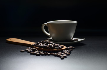 dark coffee bean with glass on black tone