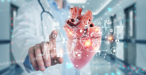 Leinwandbilder - Cardiologist using digital x-ray of human heart holographic scan projection 3D rendering