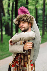 City Cossack 1st half of the 17th century. In a caftan, a fur hat in the hands of birding.