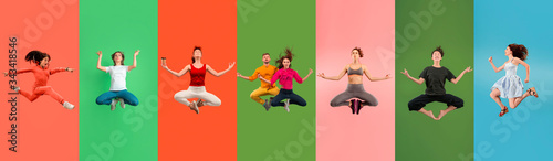 Fotomural Young emotional people jumping high, look happy and calm, balanced on multicolored background