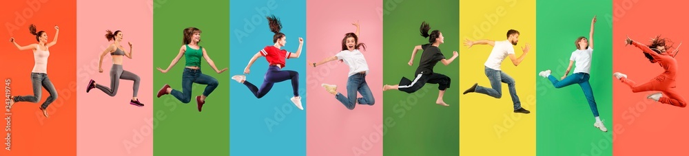 Obraz Young emotional people jumping high, look happy, cheerful on multicolored background. Celebrating, winning men and women. Emotions, facial expression concept. Trendy colors. Collage made of 7 models. fototapeta, plakat