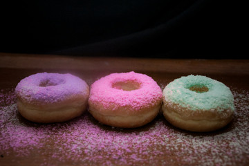 Donuts with colorful, chocolate and cheese topping