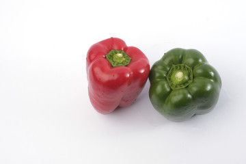 Wall Mural - Green and red bell pepper on white background