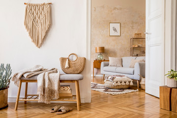 Wall Mural - scandinavian interior of open space with wooden bench, grey sofa, pillows, palid, picture frame, mac