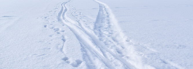  Tire tracks in the snow. Snowy road.