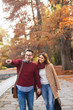 © Jelena - Portrait of a couple in the park holding hands and enjoying autumn.