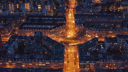 Wall Mural - Aerial view of downtown Amsterdam in evening, Netherlands from above, drone shot.