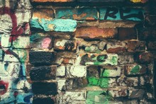 Graffiti On Old Damaged Brick Wall