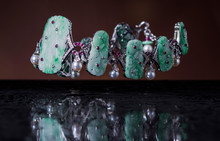 Close-up Of Jade Tiara In Mid-air Over Wet Table